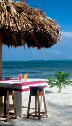 Ambergris Caye palapa on the sand with view to sea – Best Places In The World To Retire – International Living